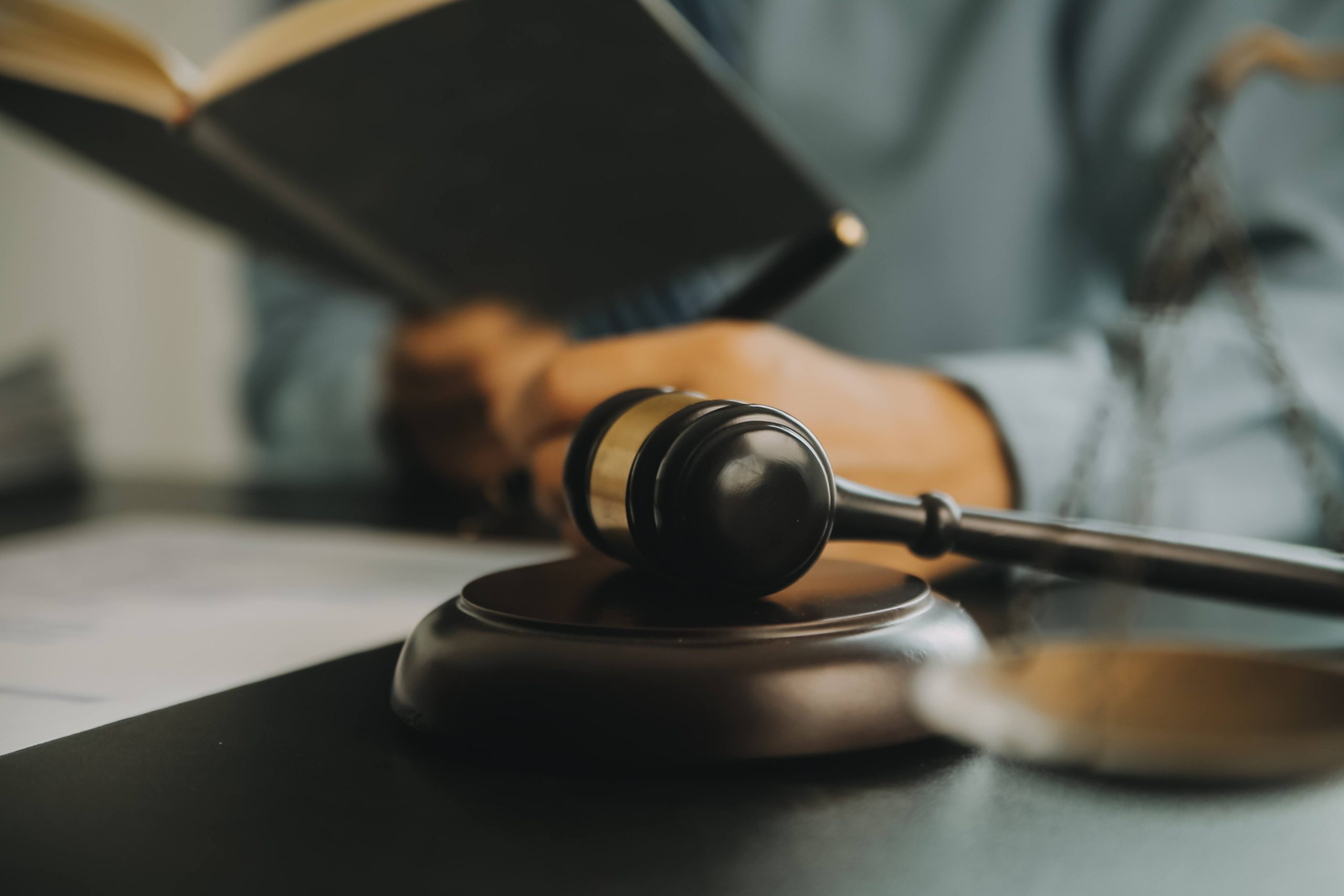 jpeg optimizer justice law concept legal counsel presents client signed contract with gavel legal law legal having team meeting law firm background 1 scaled