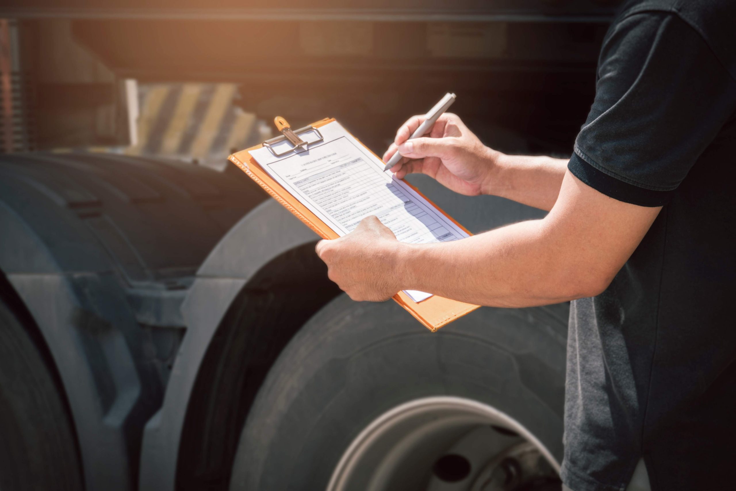 jpeg optimizer truck driver holding clipboard checking daily checklist scaled