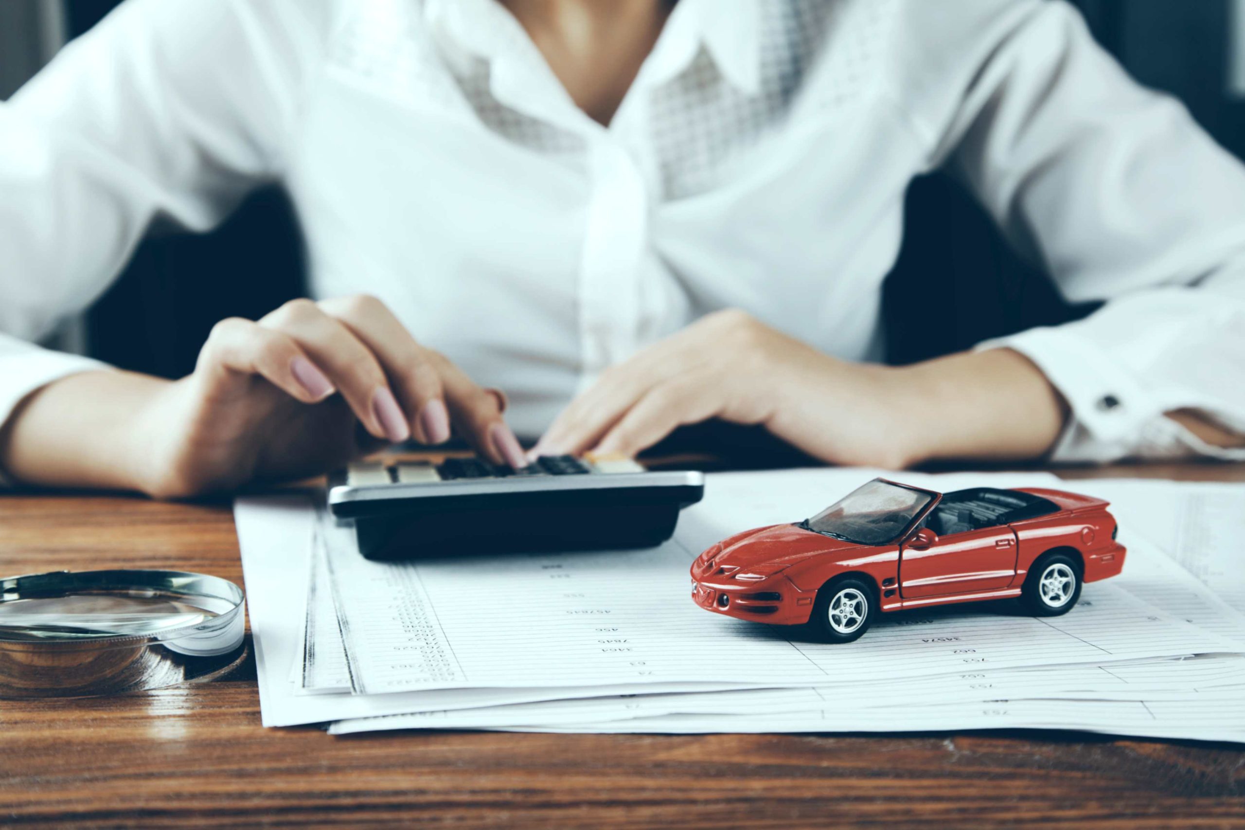 jpeg optimizer woman hand car model with calculator scaled