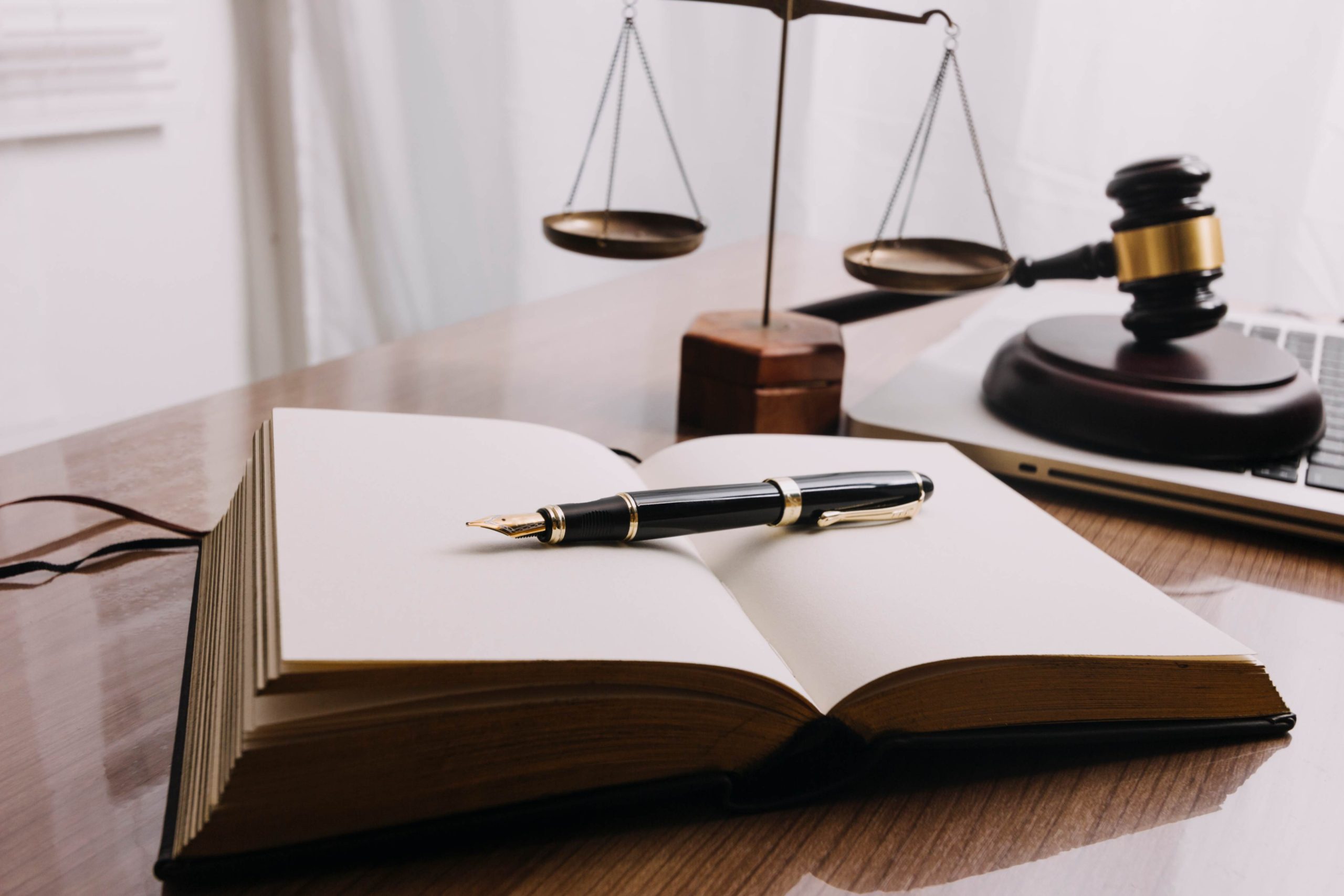 jpeg optimizer business lawyers discussing contract papers with brass scale desk office law legal services advice justice law concept picture with film grain effect 5 scaled