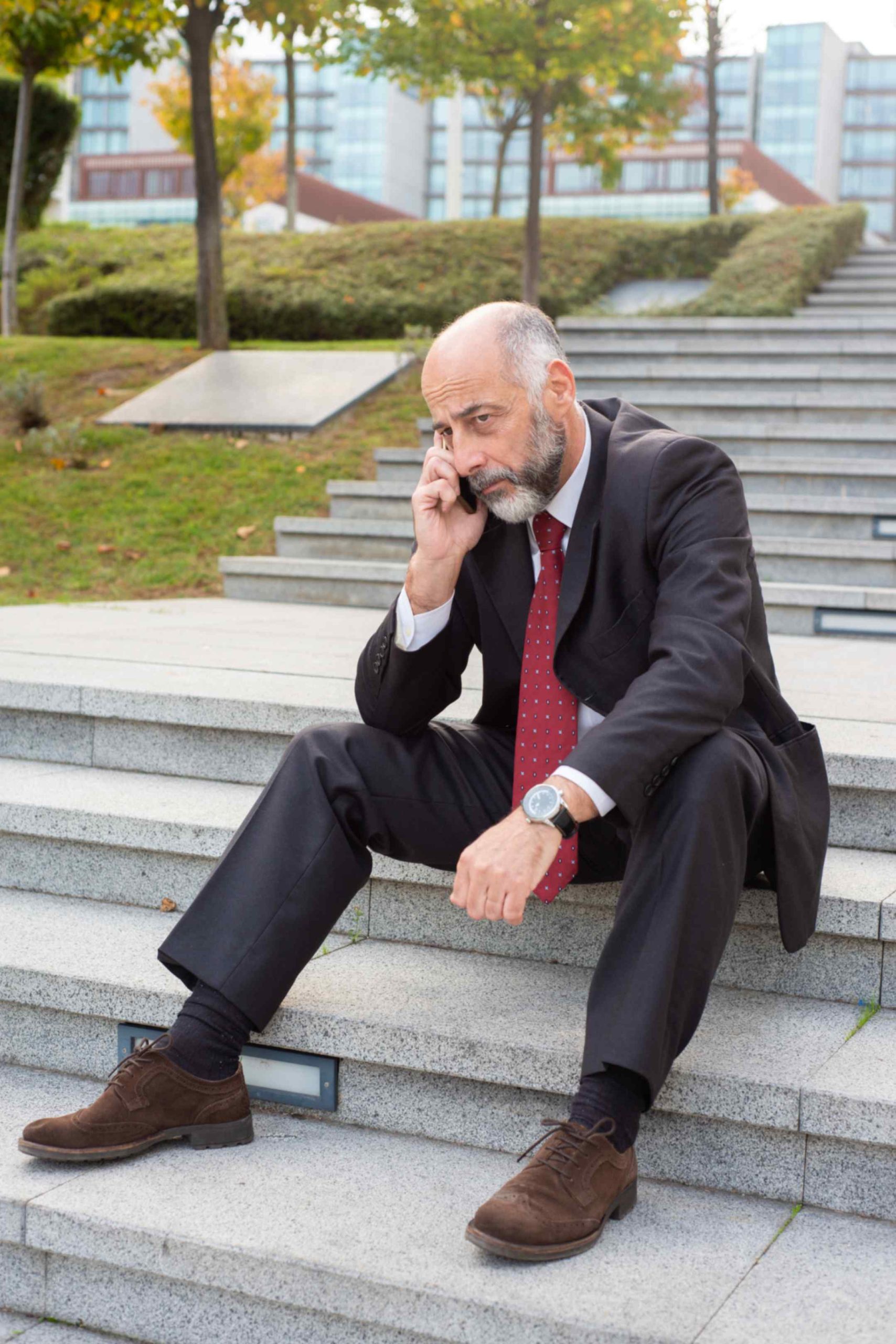 jpeg optimizer tired mature businessman speaking cellphone scaled